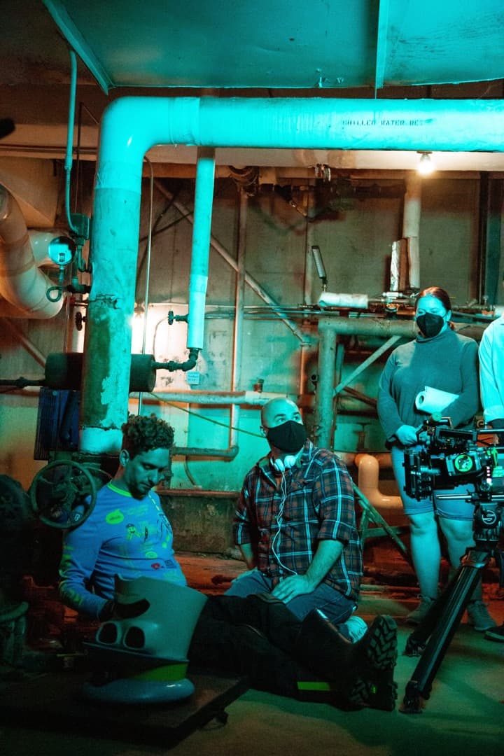 Behind the scenes photo 2 from Clone Cops production showing director danny done and featured extra adam gowdy preparing for a scene